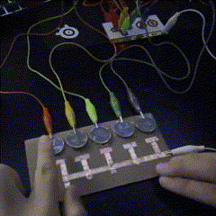 The third circuit is similar to the last one though instead of graphite there are quarters, here I was testing how effective coins, in this case quarters would be and how they would work alongside copper tape.