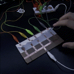 This is the sixth circuit, it is a paper and cardboard piano-like circuit that uses copper tape as the conductor and paper as the tiles, the design is pretty straightforward, the connections are connected to the tiles and the ground is just on the other side of the board.